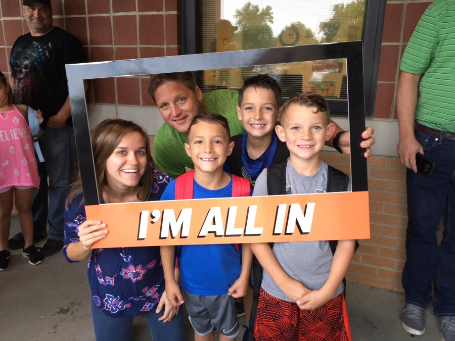 people holding a frame sign